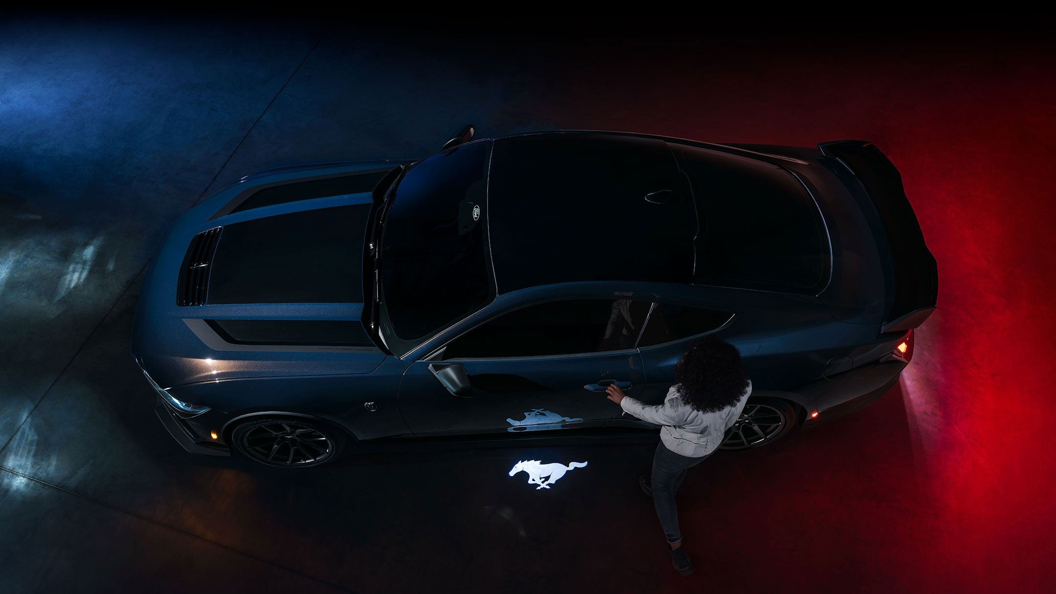 2024 Ford Mustang® Dark Horse™ model with a driver approaching the vehicle | Fox Ford Inc. in Wolf Point MT