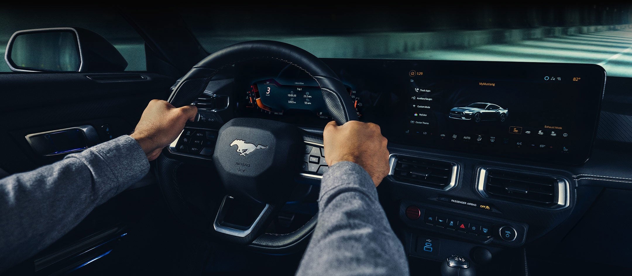 A 2024 Ford Mustang® model interior with a person driving | Fox Ford Inc. in Wolf Point MT
