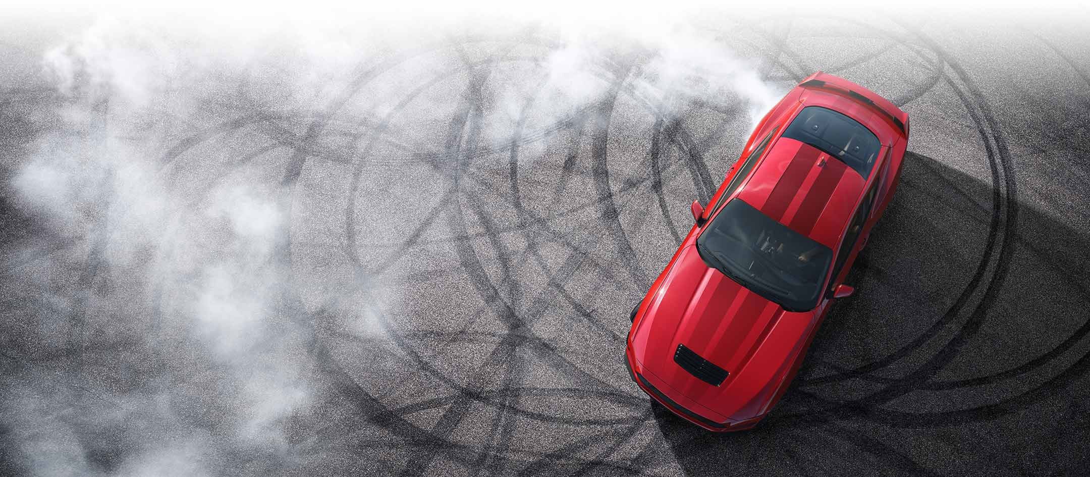 Overhead view of a 2024 Ford Mustang® model with tire tracks on pavement | Fox Ford Inc. in Wolf Point MT