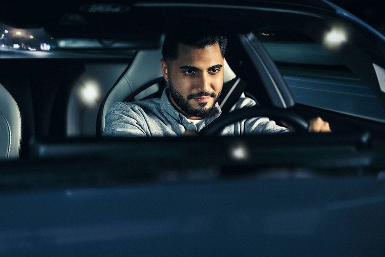 Person sitting in the driver’s seat of a parked 2024 Ford Mustang® coupe | Fox Ford Inc. in Wolf Point MT